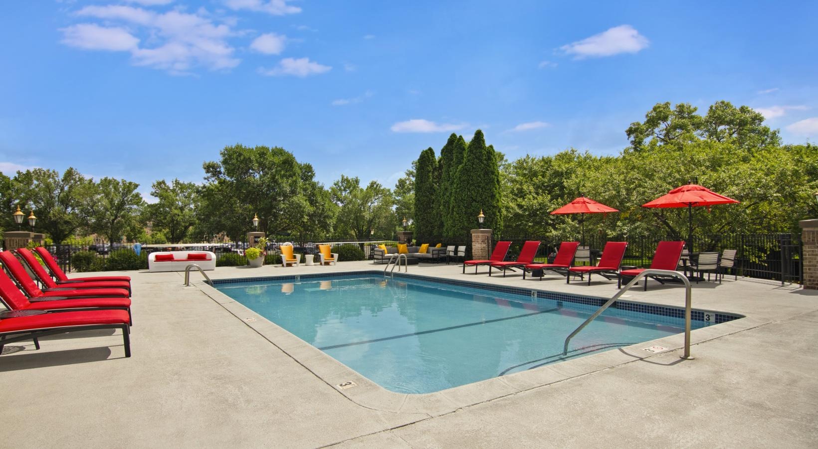a pool with chairs around it