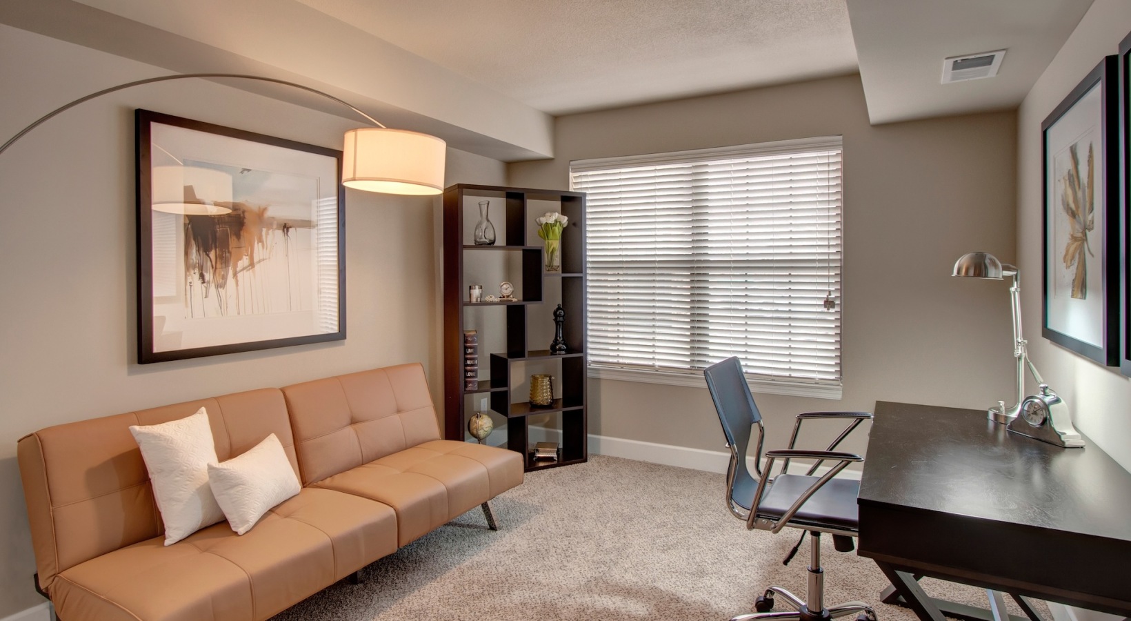 room with couch and desk